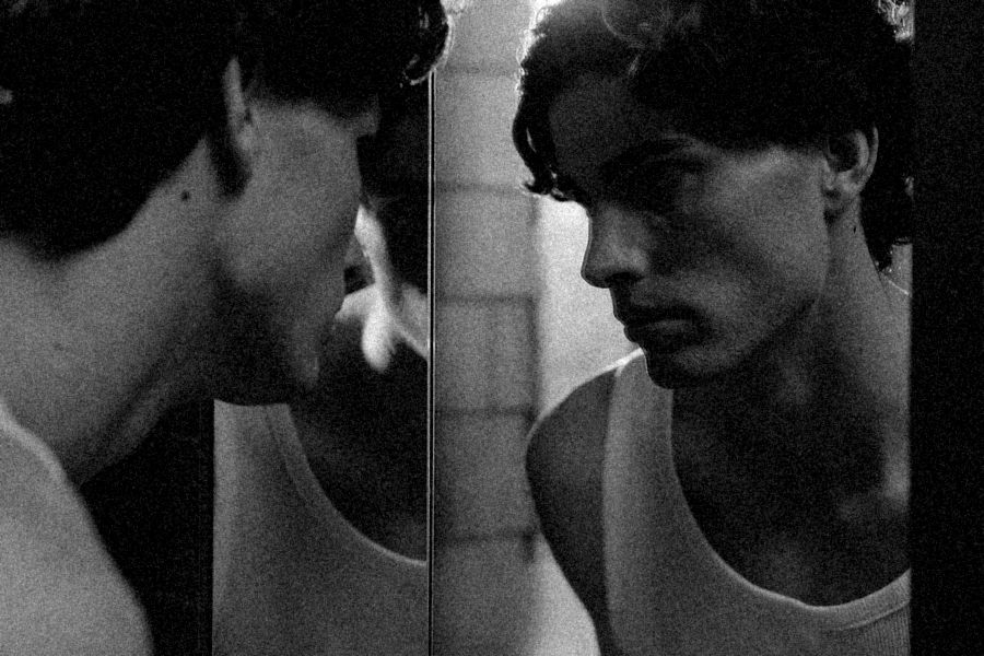 Man looking into a mirror