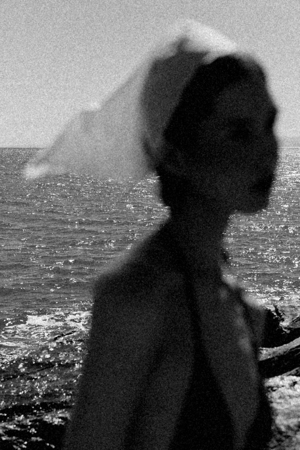 Woman in a headscarf by the sea