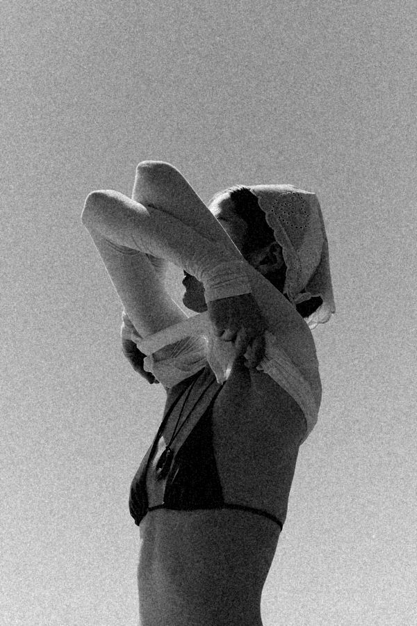 Woman stretching against the sky