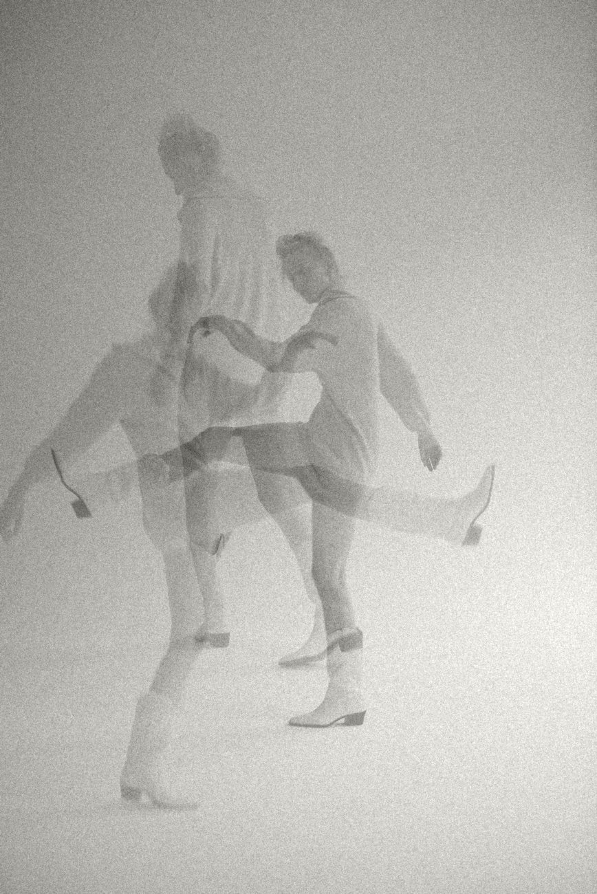 Two dancers in a double exposure