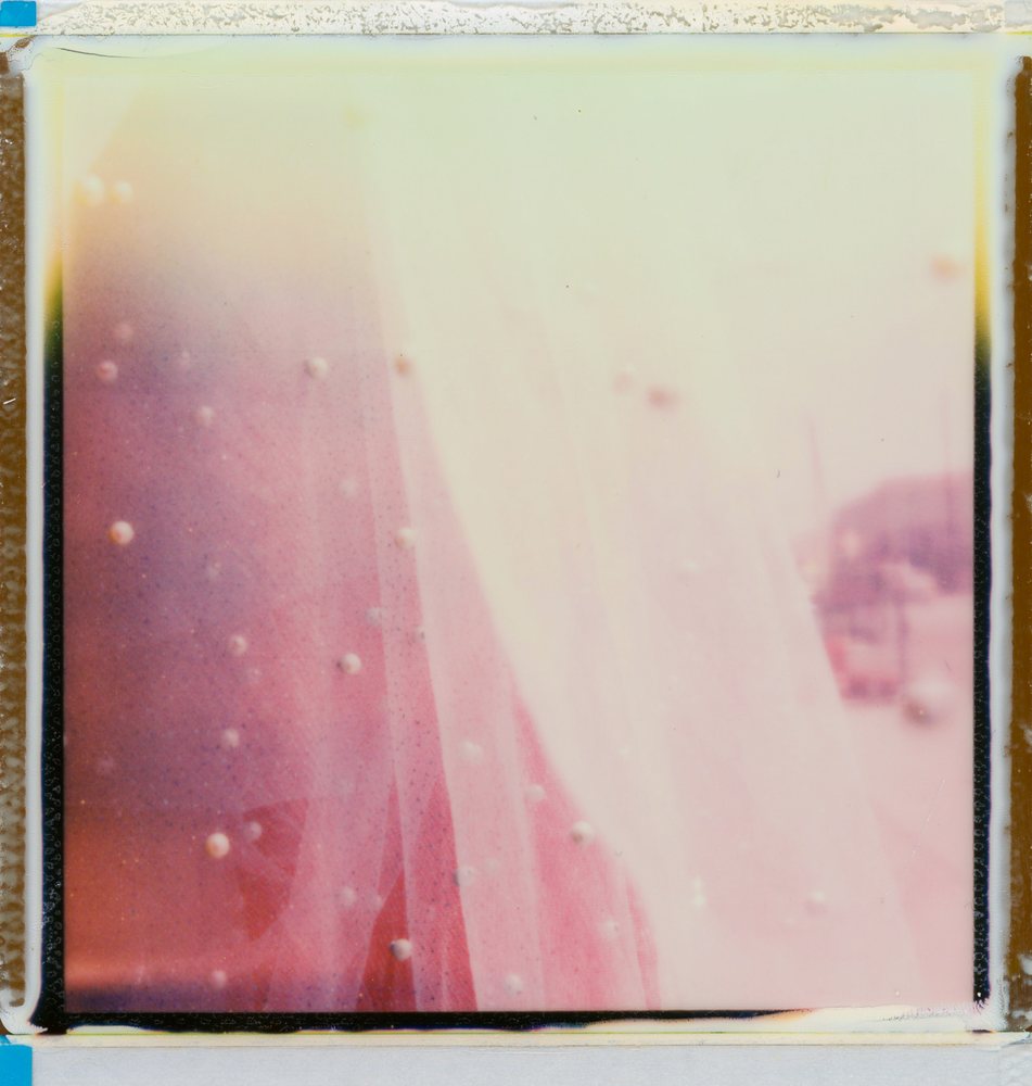 Peel-apart instant print: pink and cream light leak