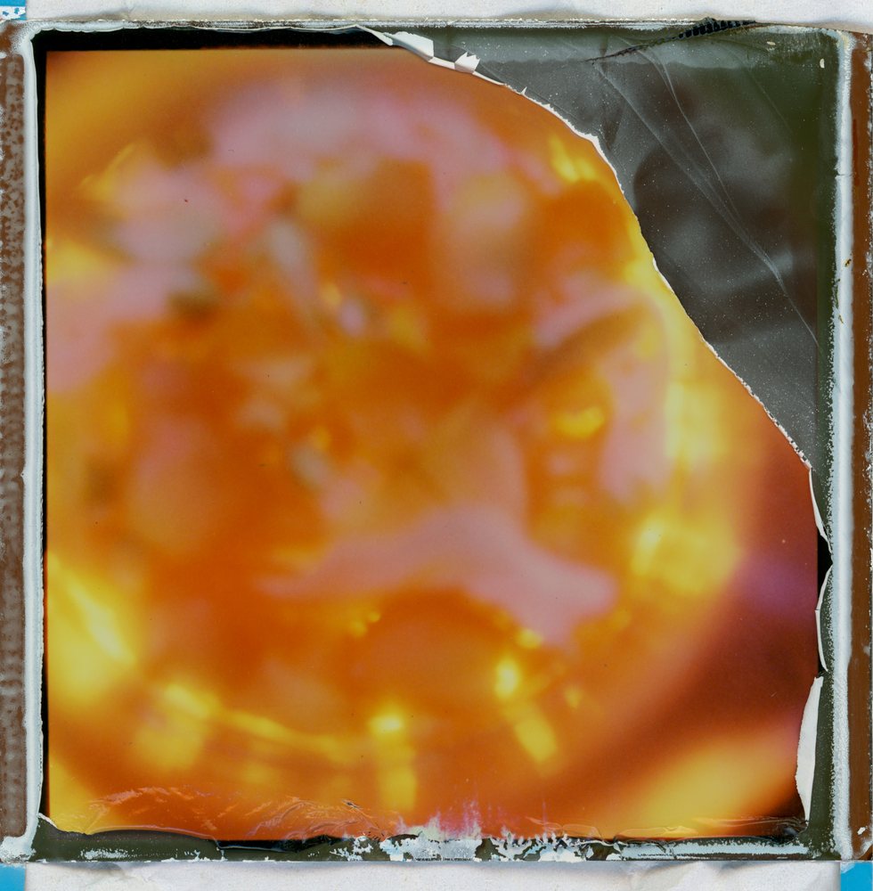 Peel-apart instant print: a blazing orange sun shape